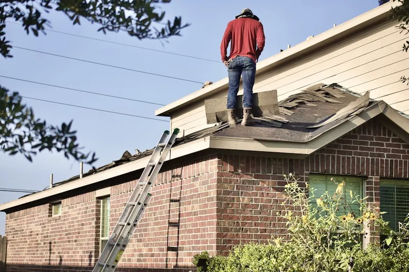 Professional roofer working on a residential roof in Santa Rita Ranch